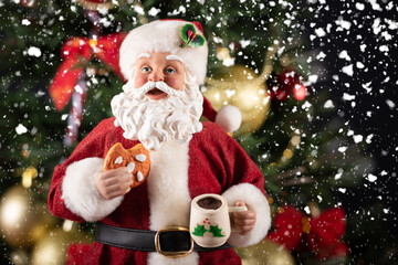 Santa Claus decoration on a christmas tree blurry background. Christmas party.