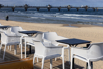 Beach restaurant on the Baltic Sea near the pier. Landscape after the high season, no people, Miedzyzdroje, Poland.