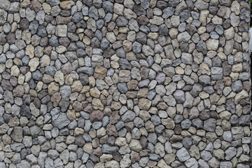 A stone wall made of polygonal stones joined by concrete provides strength and is ideal as a backdrop.