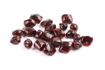 Image of tamarind seeds on a white background.