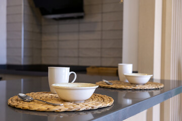 Close-up of table set for breakfast for two people with everything set up in a house