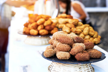 Bar counter with plates of croquettes and pasties and blur effect