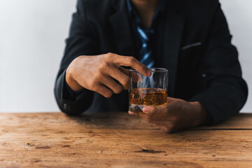 Alcoholism concept. Young man drinking alcohol too much. drunk asian man hold whisky glass addicted alcohol need therapy.