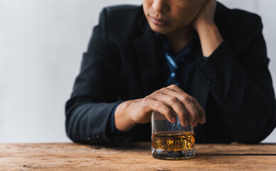 Alcoholism concept. Young man drinking alcohol too much. drunk asian man hold whisky glass addicted...