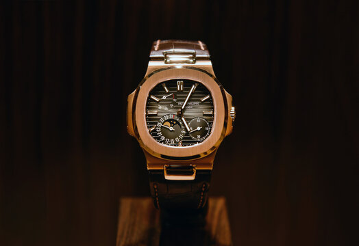 BANGKOK, THAILAND - Sep21, 2022 :Patek Philippe Nautilus 5712R  Rose gold black brown Leather Men's Watch displayed in a store