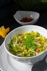 White cabbage with dill and diced bacon