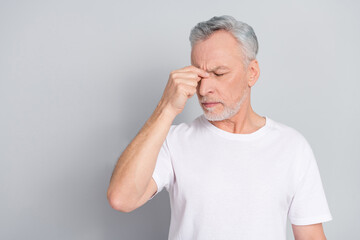 Photo of overworked aged man touch nose suffer severe head ache isolated silver color background