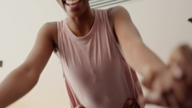 Fitness couple, acro yoga and exercise while laughing and having fun during a home workout for health, fitness and wellness. Closeup happy black man balance lifting silly woman partner for support