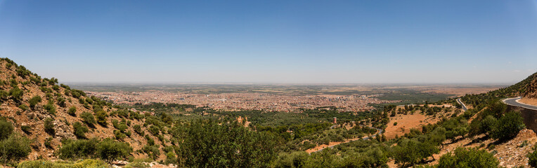 Fototapeta na wymiar Beautiful panoramic view of the Moroccan city of Beni Mellal-Jenifra which is located between the Middle Atlas and the Tadla plain, in the center of Morocco. Concept landscape, city.
