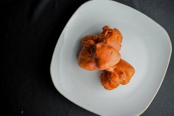 Orang-orang cake is a typical snack from Indonesia. Made from a mixture of wheat flour and bananas, then fried.