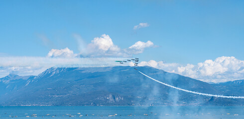 Tricolor arrows, the Italian aerobatic team, flying over Lake Garda - 532207686