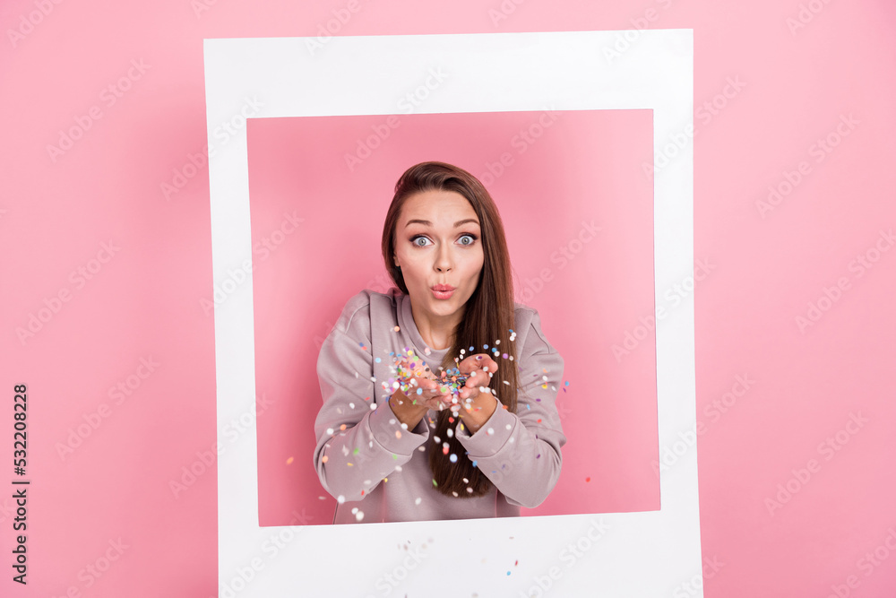 Sticker Photo of cheerful lady inside white paper image arm hold glitter blow congratulate you isolated on pink color background