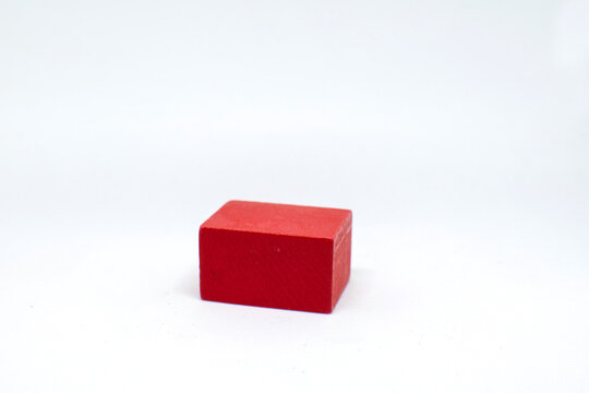 Group of objects of different geometric forms of wood, triangle, bucket, cylinder and rectangle on a white background