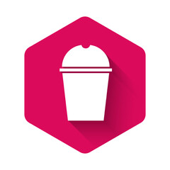 White Paper glass and water icon isolated with long shadow. Soda drink glass. Fresh cold beverage symbol. Pink hexagon button. Vector Illustration