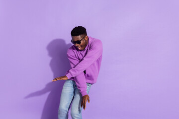 Portrait of ecstatic satisfied man enjoy event disco crossed hands good mood isolated on violet color background