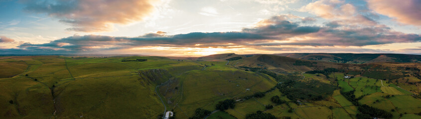 Panorama of welsh countryside. British landscape. Aerial panoramic view of typical british farmers fields and some sheep. England UK. Scenic British Countryside at Summer. 