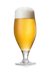 Glass of lager draught beer with foam and bubbles on white background.