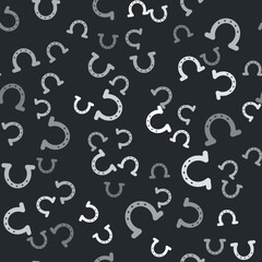 Grey Horseshoe icon isolated seamless pattern on black background. Vector