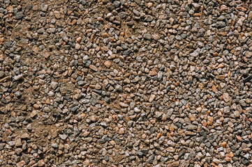 Background, texture of small pebbles with sand. Photography of nature.