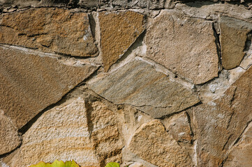 Background, texture of a wall of uneven large stones.