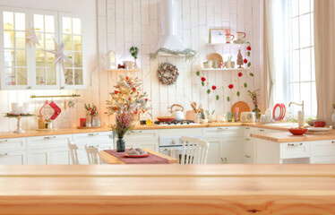 Empty wooden table on background of light christmas kitchen in scandinavian style. Christmas background. Ready for product montage.Merry Christmas and Happy New Year! Banner.Mockup.