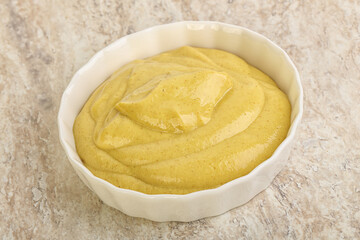 Organic mustard sauce in the bowl