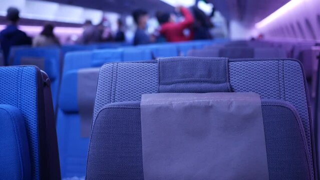 purple color Empty passenger airplane seats in the cabin