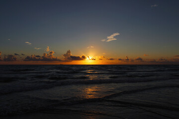 Fototapeta premium beautiful tropical sunrise with clouds and sunset on the sea