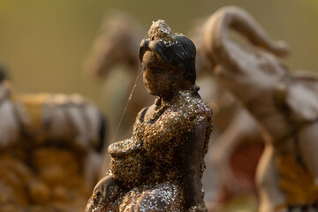 Religious offerings in the form of decorative figurines of elephants and people, Sukhothai Historical Park, Thailand