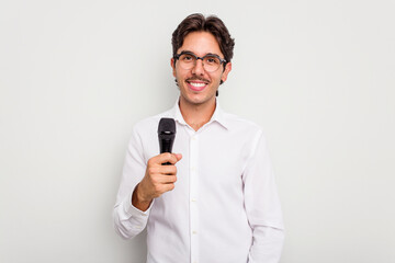 Young hispanic singer man isolated on white background happy, smiling and cheerful.