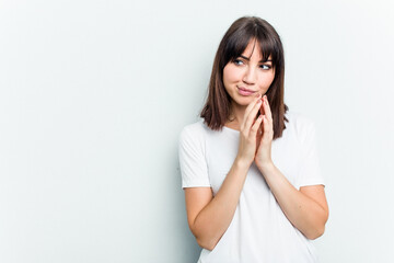 Young caucasian woman isolated on white background making up plan in mind, setting up an idea.