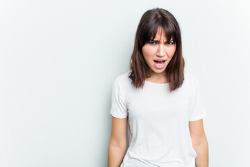 Obraz premium Young caucasian woman isolated on white background shouting very angry, rage concept, frustrated.