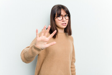 Young caucasian woman isolated on white background being shocked due to an imminent danger