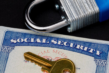 Social security card and lock. Identity theft, credit fraud and personal information security...