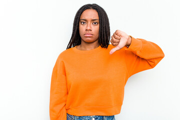 Young African American woman isolated on white background showing a dislike gesture, thumbs down....