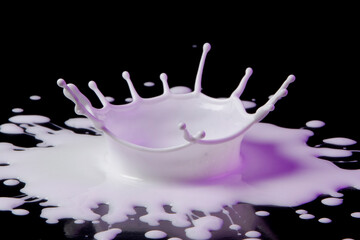 Drop of white paint on Black background