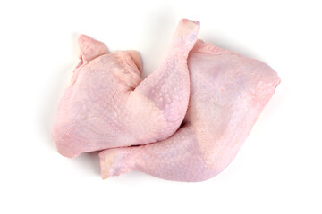 Raw chicken leg quarters, isolated on white background.