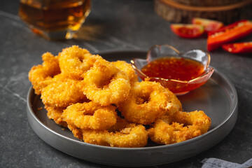 Deep fried squid rings breaded with thai sauce.