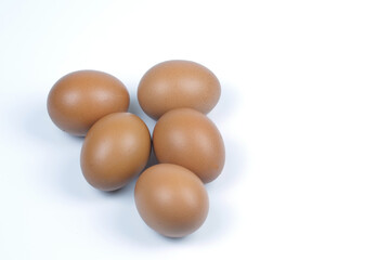 Small group of Chicken eggs on white background. Top view