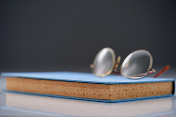 selective focus on reading glass and old book