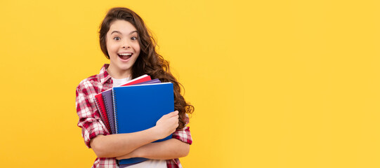 surprised school kid ready to study with workbook, back to school. Portrait of schoolgirl student, studio banner header. School child face, copyspace.