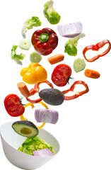 Fresh vegetables falling into a bowl