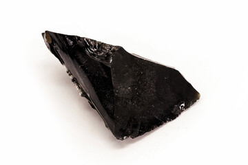 Black Obsidian, black and crystalline ore on isolated white background. Black colored stone,...