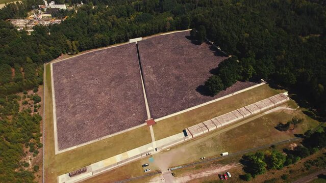 Belzec Death Camp. Former nazi death camp ruins in the middle of green forest. Birdseye view of holocaust memorial museum grounds. Horizontal shot. High quality 4k footage