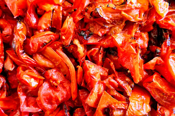 Close up of San Marzano and Roma Italian  tomatoes roasted in the oven prior to being blitzed and turned into pure tomato paste or sauce
