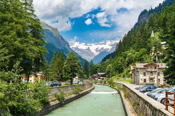 view of the Lys river course with the background of Monte Rosa in Gressoney-Saint-Jean, Aosta Valley, Italy 