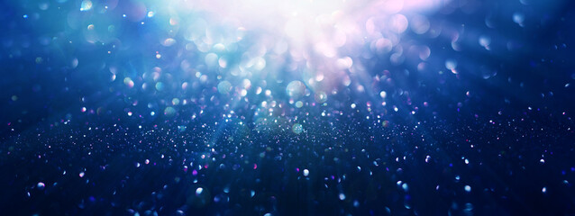 Abstract background of  glitter lights. De-focused background. 