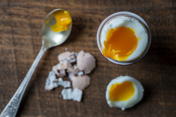 Perfect soft boiled egg on a table. Traditional food for healthy breakfast. Close-up shot.