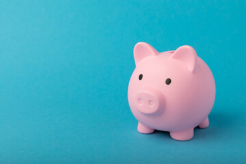 Piggy bank on a blue background.The concept of investment and saving money.Investments.Place of milking text. Place to copy. mockup