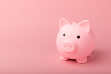 Piggy bank on a pink background.The concept of investment and saving money.Investments.Place for milking text. Place to copy. mockup